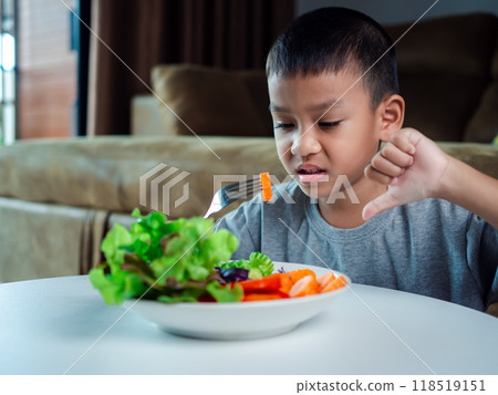 Children do not like to eat vegetables, Little cute boy refuses to eat healthy vegetables, Nutrition healthy eating habits for kids concept, Children do not like to eat vegetables. Children do not like to eat vegetables, Little cute boy refuses to eat healthy vegetables, Nutrition healthy eating habits for kids concept, Children do not like to eat vegetables. 118519151