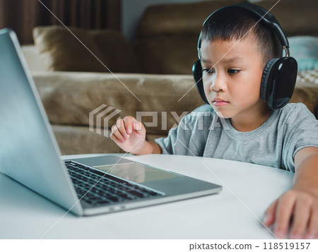 Online education, Technology studying at home using laptop computer, Student distance learning virtual distance online class on video call virtual lesson, Teaching child boy with remote education. Online education, Technology studying at home using laptop computer, Student distance learning virtual distance online class on video call virtual lesson, Teaching child boy with remote education. 118519157