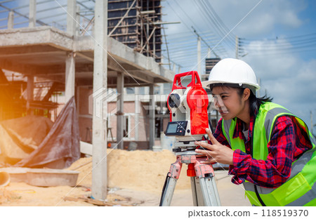 Surveyor and survey equipment on construction site, Land and soil development, Survey equipment, Theodolite for measurement construction work, Civil engineer or Architect working surveyor. Surveyor and survey equipment on construction site, Land and soil development, Survey equipment, Theodolite for measurement construction work, Civil engineer or Architect working surveyor. 118519370