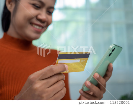 Online banking transaction concept, Happy woman with credit card using smart phone and shopping online, Ecommerce and secure mobile banking concept, Making online payments. 118520001