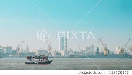 Mumbai, India. Boat with Tourists floating on the Arabian Sea. Tourists boats floating against port background. Many Birds Of Seagull Flies Behind Boat 118520162