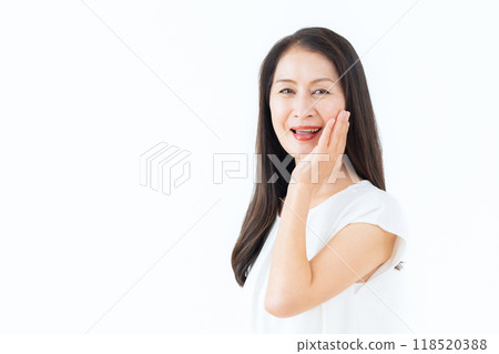 Middle-aged woman doing skin care Middle-aged woman doing skin care 118520388