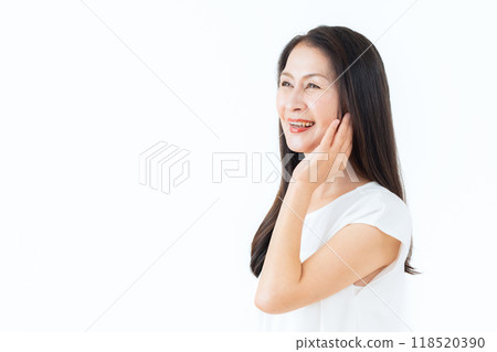 Middle-aged woman doing skin care Middle-aged woman doing skin care 118520390
