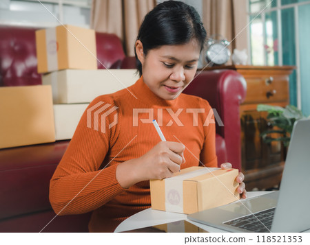 Asian woman receive order on laptop, Startup small business entrepreneur SME, Success young Asian small business owner home office, Online sell marketing delivery, Ecommerce concept, Online business. 118521353