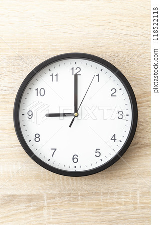 Wall clock on wood grain background 118522118