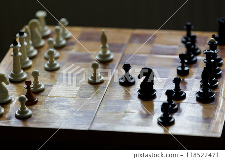 Strategic chess match in a quiet room showcasing black and white pieces 118522471