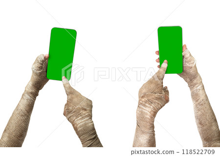 Set of mummy hands have dirty bandages on them using mobile phones or cellphones with green screens. Mummy, devil, evil, satan or zombie hands 118522709