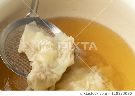 Wonton: Boil wonton in soup 118523080