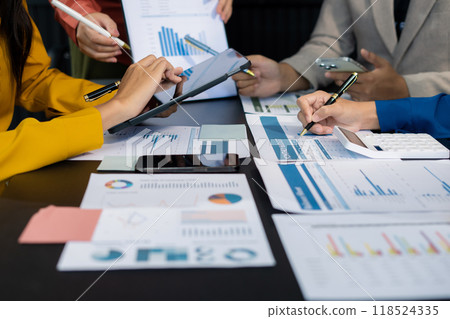 Close up Businessman and partner using calculator and laptop for calculation finance, tax, accounting, statistics and analytic research concept. in the office. Close up Businessman and partner using calculator and laptop for calculation finance, tax, accounting, statistics and analytic research concept. in the office. 118524335