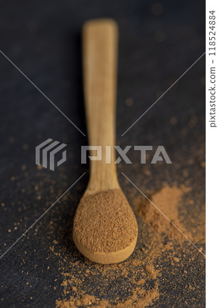 cinnamon tree bark with golden powder 118524884
