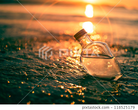 Glass bottle on the beach in the evening Lens flare 118525179