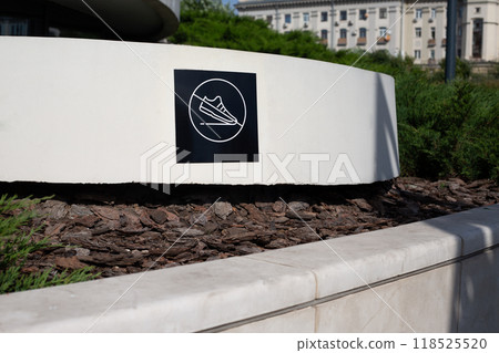 Do not tread on surface, sign with shoes crossed out prevents walking on park decorations, restricted traffic area for people Do not tread on surface, sign with shoes crossed out prevents walking on park decorations, restricted traffic area for people 118525520