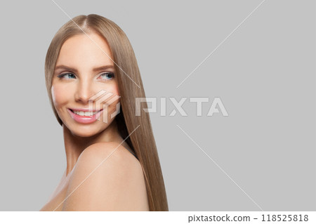 Smiling model. Woman with long brown hair, natural makeup and healthy clean skin Smiling model. Woman with long brown hair, natural makeup and healthy clean skin 118525818