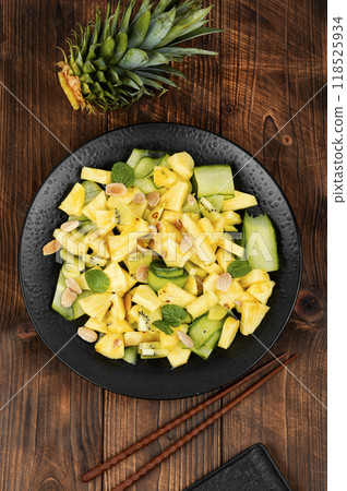 Delicious ananas and cucumber salad. 118525934