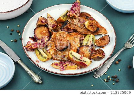 Pork steaks in fruit marinade. 118525969