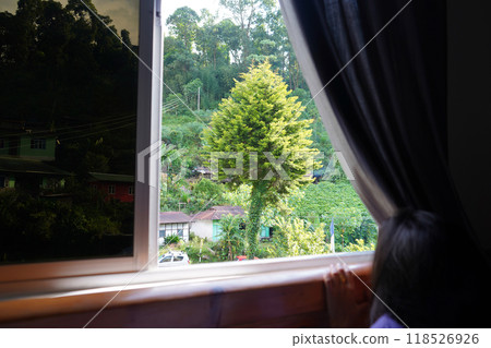 View from luxury bed through open Window at Sikkim hotel 118526926