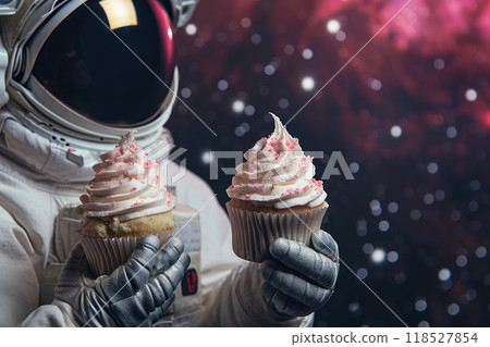 Cosmic Indulgence: Cupcakes in the Hands of an Astronaut Cosmic Indulgence: Cupcakes in the Hands of an Astronaut 118527854