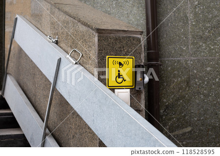 Yellow icon with call button for the disabled people for lifting, convenience for wheelchair users while walking in city, folding ramp for disabled people on narrow stairs 118528595