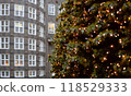 Christmas tree in Hamburg close up with a wall of a building in the background 118529333