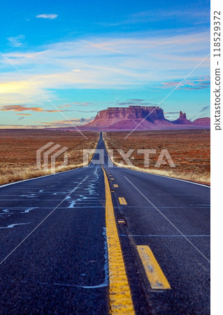Panoramic picture along an empty road through Monument Valley Panoramic picture along an empty road through Monument Valley 118529372