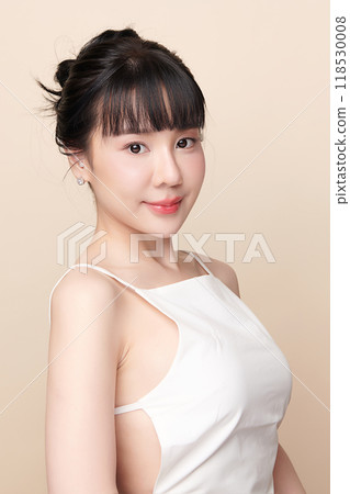 Beautiful young asian woman with clean fresh skin on beige background, Face care, Facial treatment, Cosmetology, beauty and spa, Asian women portrait. Beautiful young asian woman with clean fresh skin on beige background, Face care, Facial treatment, Cosmetology, beauty and spa, Asian women portrait. 118530008
