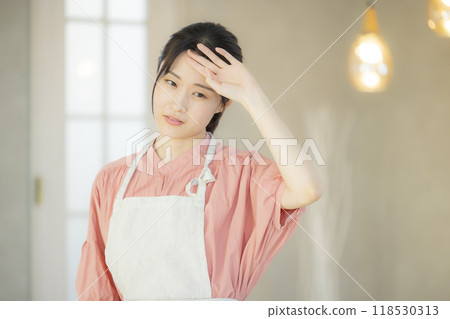 Tired apron woman 118530313