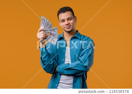 Rich african american man with Usd money. Young Guy Or Student with salary, scholarship payment. Jackpot, win 118530578