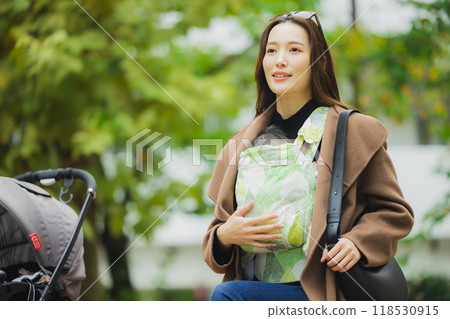 Mother walking with baby Mother walking with baby 118530915