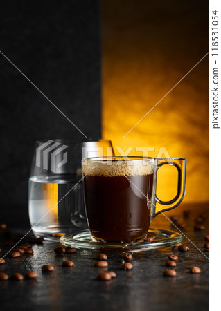 Espresso, glass of cold water, and roasted coffee beans. 118531054