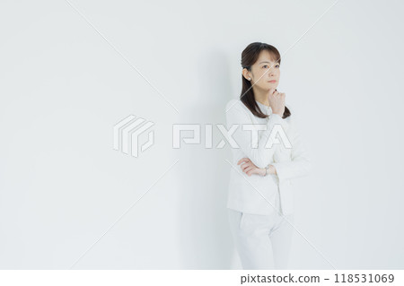 Woman in a white suit 118531069