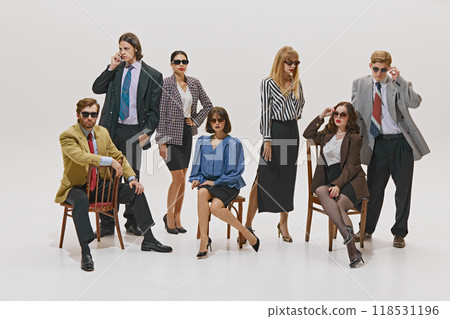 Team of young managers posing, blending bold patterns and sleek designs, showcasing confidence and style in modern business setting. Team of young managers posing, blending bold patterns and sleek designs, showcasing confidence and style in modern business setting. 118531196