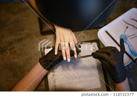 Closeup manicure process for female client in beauty salon 118532377