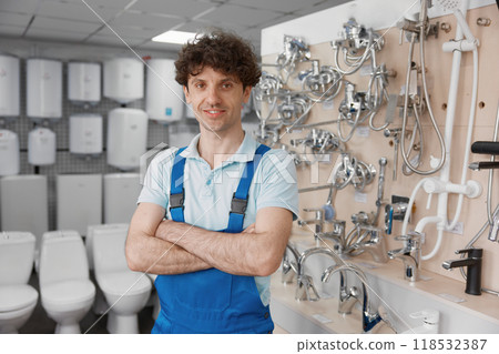 Male plumber near stainless steel washbasin water tap at store Male plumber near stainless steel washbasin water tap at store 118532387
