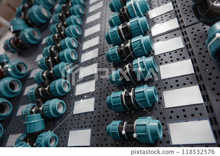 Plastic adapters and pvc fitting supplies assortment for plumbing on display 118532576