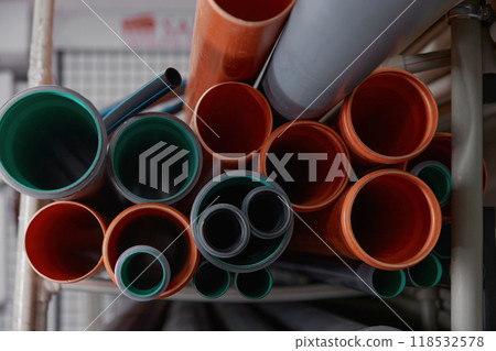 Closeup view on plumbing shop showcase with plastic water pipes Closeup view on plumbing shop showcase with plastic water pipes 118532578