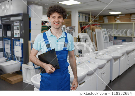 Portrait of friendly smiling salesman at plumbing retail store 118532694