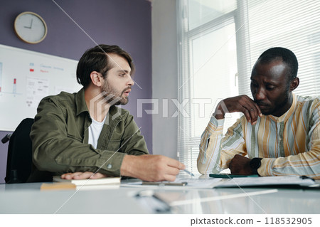 Business Colleagues Cooperating At Meeting 118532905