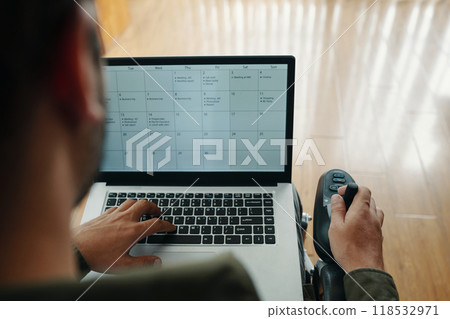 Man Checking Schedule On Laptop 118532971