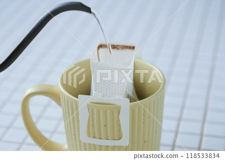 yellow cup freshly brewed coffee with convenient drip filter on table. prepare freshly brewed coffee yellow cup freshly brewed coffee with convenient drip filter on table. prepare freshly brewed coffee 118533834