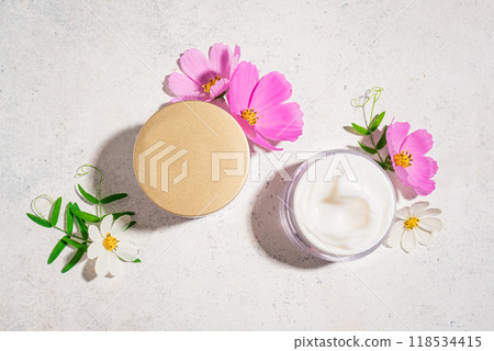Cosmetic cream jar with delicate pink flowers Cosmetic cream jar with delicate pink flowers 118534415