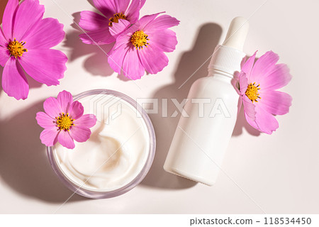 Natural organic cosmetics with delicate pink flowers Natural organic cosmetics with delicate pink flowers 118534450