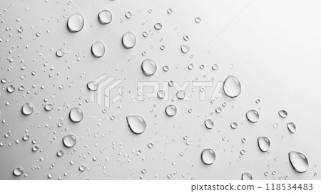 Water droplets on a smooth surface create a tranquil pattern in natural light Water droplets on a smooth surface create a tranquil pattern in natural light 118534483