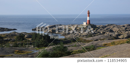 Eigeroy lighthouse, rock formations and North Sea, Norway. 118534905