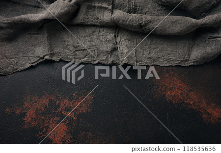 Black gauze kitchen towel on black brown surface, top view. Copy space Black gauze kitchen towel on black brown surface, top view. Copy space 118535636