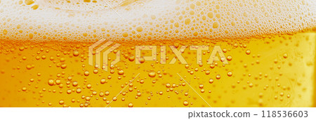 Beer texture. Close-up of beer with foam on top Beer texture. Close-up of beer with foam on top 118536603