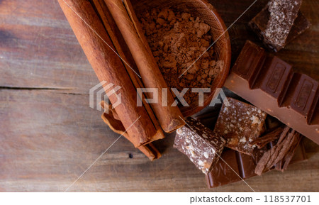 Chocolate chunks of different flavours on wooden background.Copy space Chocolate chunks of different flavours on wooden background.Copy space 118537701