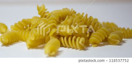Very close up picture of Rotini corkscrew pasta isolated on white background Very close up picture of Rotini corkscrew pasta isolated on white background 118537752