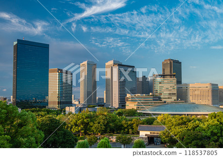 Osaka Business Park illuminated by the setting sun - a view from inside Osaka Castle 118537805
