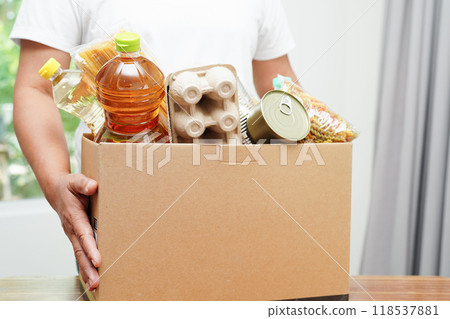 Foodstuffs in donation box for volunteer to help people. 118537881