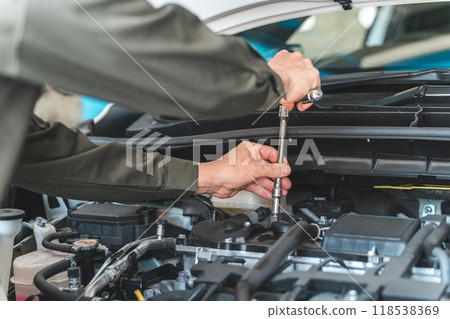 The hands of an auto mechanic working in the engine room The hands of an auto mechanic working in the engine room 118538369